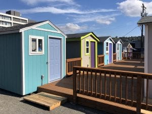 Six tiny houses share a common deck in Lake Union Village. Photo courtesy of LIHI.